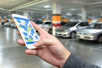 Car sharing , pick me up , auto drive and internet of things in smart car concept. Hand holding...