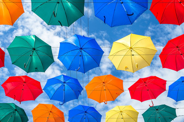 The sky of colorful umbrellas. Street with umbrellas.