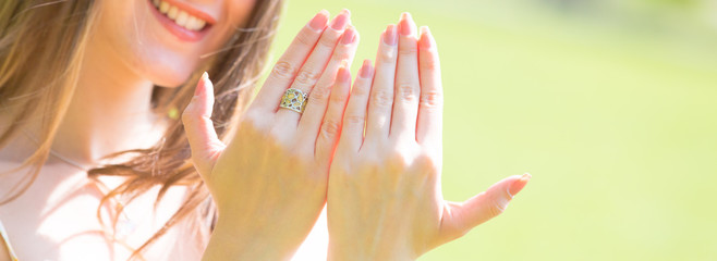 Portrait of young beautiful woman with long hair Shows beautiful nails on hands