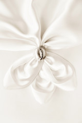 Obraz na płótnie Canvas White draped silk with luxury ring