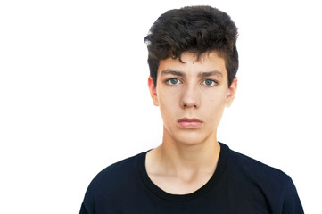 Handsome teenager in a black T-shirt on a white background
