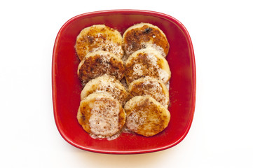 Fried delicious cheese cakes on red plate