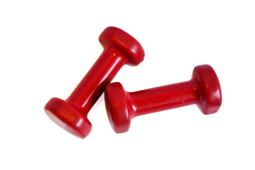 Red dumbbells for boys or girls on a white background