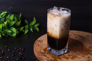 Pour ice coffee on dark background