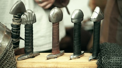 Handles of swords and chain armour