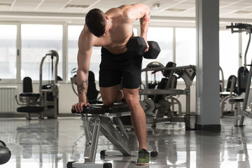 Back Exercise With Dumbbells In A Gym