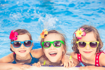 Happy children in the swimming pool