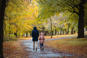Fototapeta premium mother and daughter at the autumn park