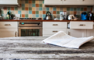 Obraz na płótnie Canvas blurred kitchen interior and napkin and desk space