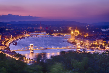 Naklejka premium Budapest Panorama with parliament and bridges during blue hour sunset. View from Citadel