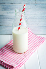 Bottle of milk with straw