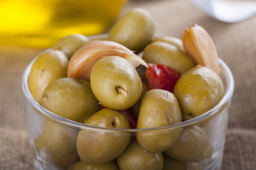 Bowl of homemade olives on a glass, typical spanish tapa