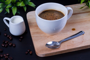 Hot coffee and milk on wood
