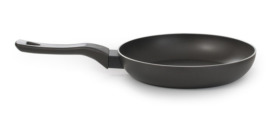 Empty black frying pan, isolated on white background, side view, close up.