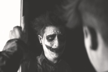 black and white clown acting backstage