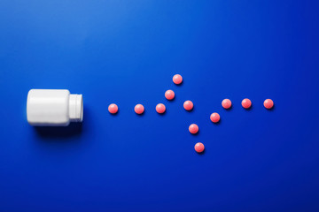 medical pills  pulse  shape and bright bottle blue background