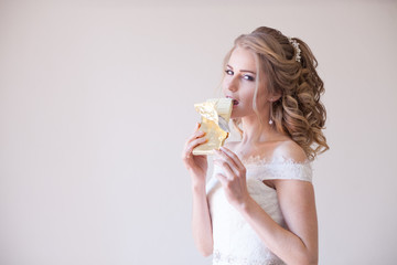 bride in wedding dress holding a chocolate