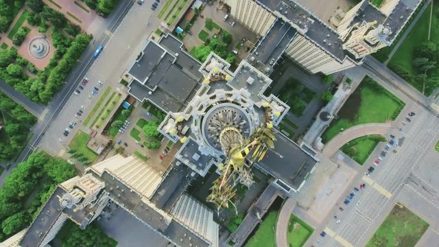 Aerial shot. Flight on a drone above the building of Moscow State University in the light of the day in the summer. View from the top of the territory of MSU, buildings, yards, infrastructure