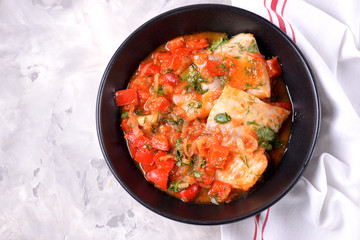 White sea fish stewed with onion, red pepper, tomatoes, garlic, coriander and cumin.