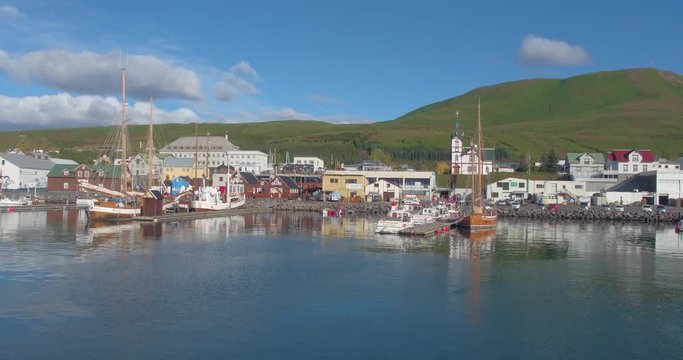 HUSAV&Iacute;K, ICELAND &ndash; SEPTEMBER 2016 : Aerial shot of Husav&iacute;k Bay on a beautiful day with boats and ships in view