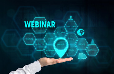 Webinar concept. Presenting gesture of businessman and chart with related keywords and signs over business background. Highlighted new skills.