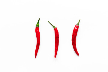 red chili pepper or paprika on white background top view