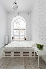 White bedroom with pallet bed