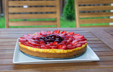 Strawberry cake on a wooden table
