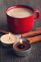 Ceramics red cup of coffee with cinnamon