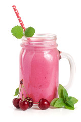 Glass of berry smoothie with cherries isolated on white background