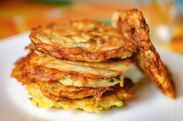 Stack of fried vegetable fritter made of zucchini