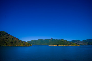 Beautiful landscape with gorgeous blue sky in a sunny day seen from ferry from north island to south island, in New Zealand