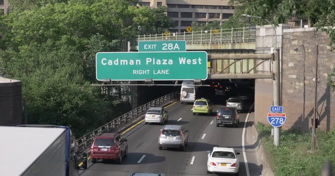 A high angle daytime establishing shot of the Cadman Plaza West exit off the Brooklyn Queens Expressway in New York City.  	