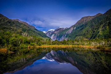 Plakat Small pond peters pond with reflection of mountain glacier Franz Josef Glacier in New Zealand