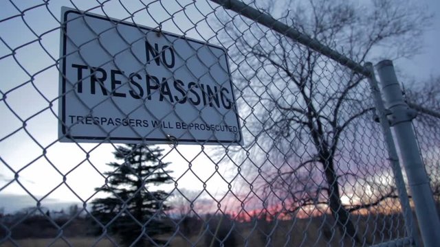 No Trespassing Sign at Dusk