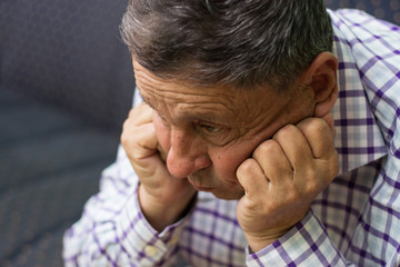 Fototapeta premium Elderly man lost in thought
