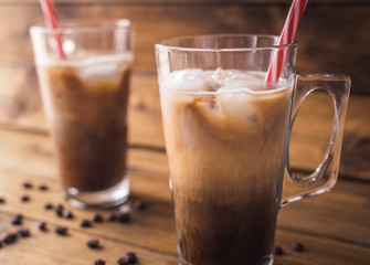 iced coffee on rustic wooden background.
