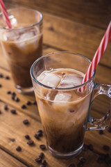 iced coffee on rustic wooden background.