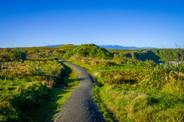 Fototapeta na wymiar Family walking in a mountain in a beautiful sunny day, South Island, New Zealand