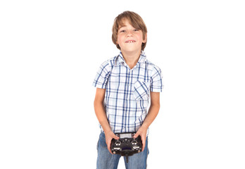 Happy boy with his drone remote control. Isolated on white.