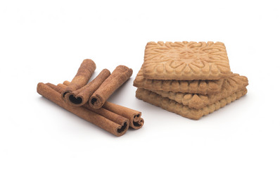 Biscuits, cinnamon sticks on white background