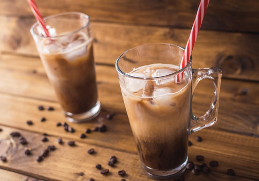 iced coffee on rustic wooden background.