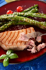 Grilled Tuna steak with roasted asparagus and parmesan