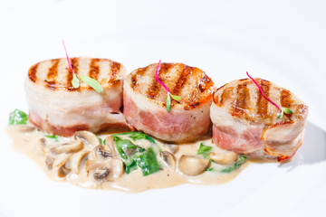 Fried meat with mushroom sauce.