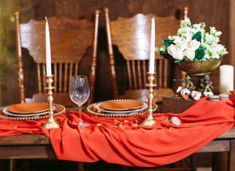 Terracotta color dinner table set.