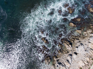 Waves crashing on rocks
