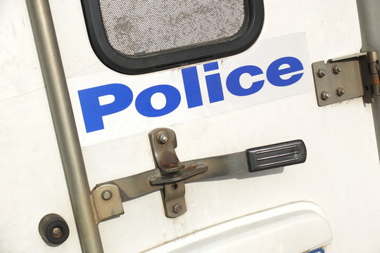 Melbourne, Australia - April 24, 2017: Back Door Of A Police Car With Locks And Sign Of The Victorian Police