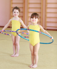 Young girls doing gymnastics.