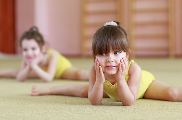 Young girls doing gymnastics.