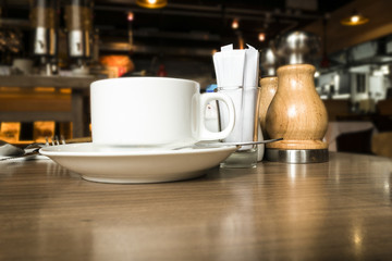 Cup of coffee on table in cafe